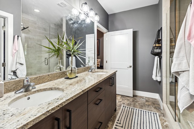 209 Forest Park Dr, Santa Rosa Beach, FL 32459 - bathroom featuring baseboards, a stall shower, and double vanity