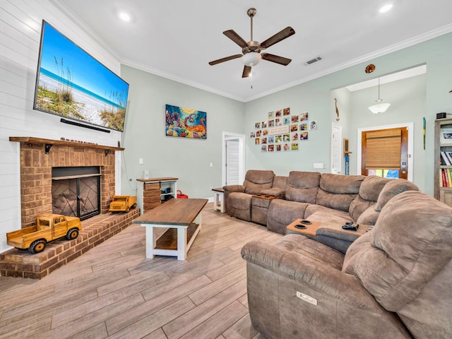 1516 Cadence Lp, Cantonment, FL 32533 - living room with wood finished floors, visible vents, a fireplace, crown molding, and a ceiling fan