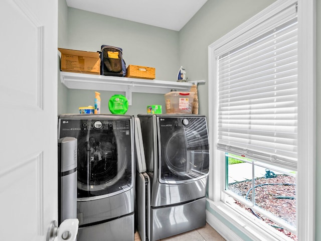 1516 Cadence Lp, Cantonment, FL 32533 - washroom with washing machine and clothes dryer, laundry area, and tile patterned floors