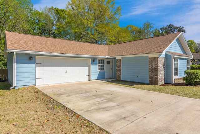 511 Oak Ave, Niceville, FL 32578 - ranch-style home featuring driveway, an attached garage, roof with shingles, and brick siding