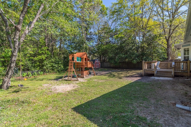 511 Oak Ave, Niceville, FL 32578 - view of yard featuring a playground and a deck