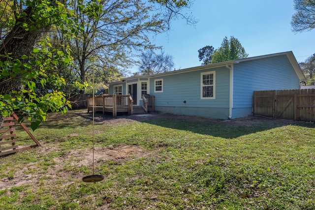 511 Oak Ave, Niceville, FL 32578 - rear view of property with a wooden deck