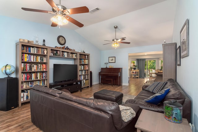 511 Oak Ave, Niceville, FL 32578 - living room with ceiling fan, wood finished floors, vaulted ceiling, and baseboards