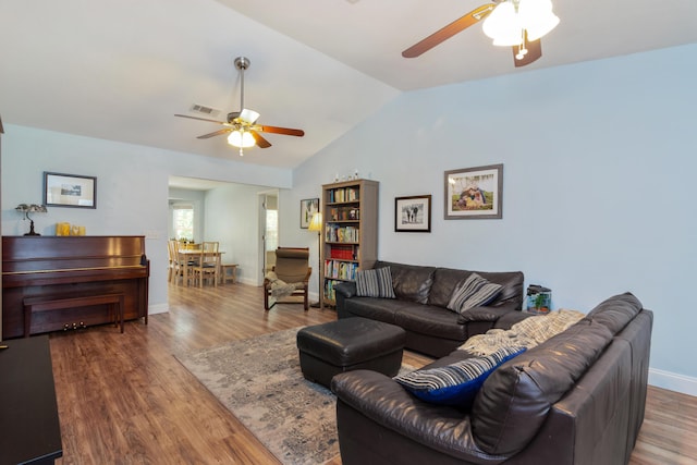 511 Oak Ave, Niceville, FL 32578 - living area with ceiling fan, lofted ceiling, wood finished floors, and baseboards