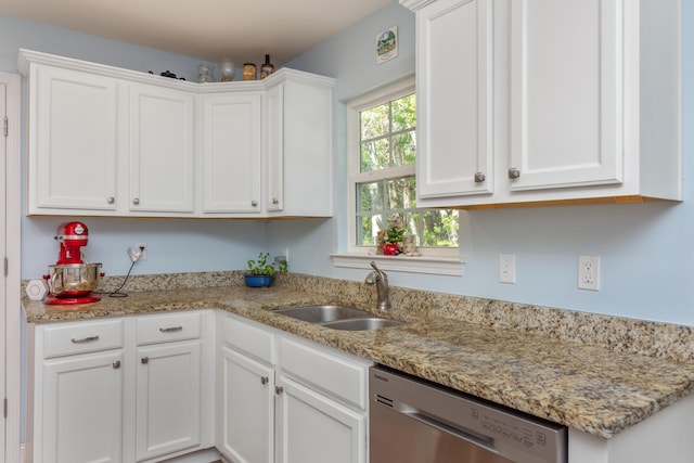 511 Oak Ave, Niceville, FL 32578 - kitchen featuring stainless steel dishwasher, a sink, white cabinets, and light stone countertops