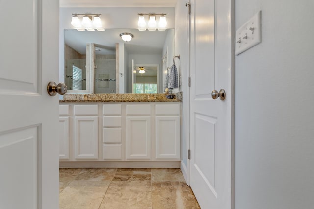 511 Oak Ave, Niceville, FL 32578 - bathroom with a shower stall, double vanity, and a ceiling fan