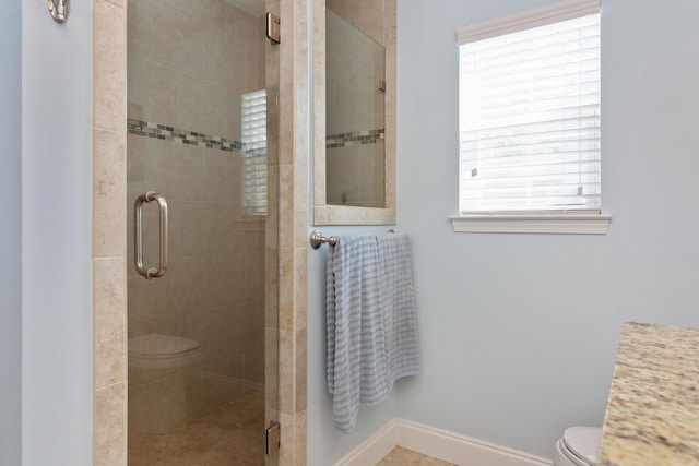 511 Oak Ave, Niceville, FL 32578 - bathroom with toilet, a stall shower, and baseboards