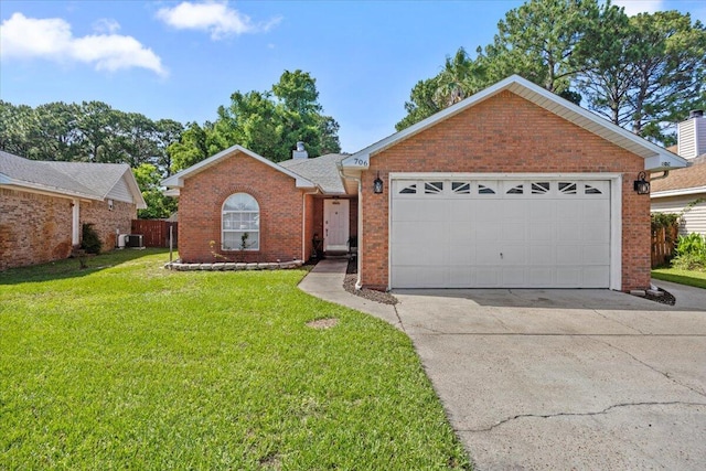 706 Vintage Cir, Destin, FL 32541 - single story home featuring brick siding, a front lawn, concrete driveway, cooling unit, and a garage