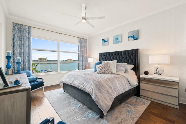 bedroom featuring ceiling fan, ornamental molding, baseboards, and dark wood-type flooring
