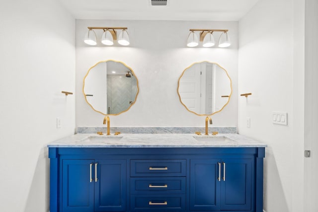 full bathroom featuring double vanity and a sink