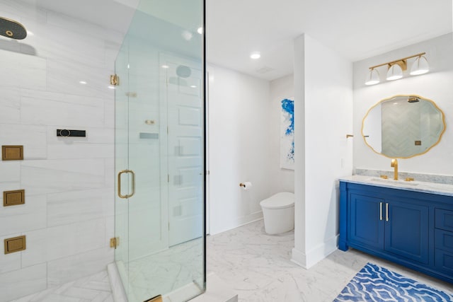 bathroom with toilet, marble finish floor, vanity, a shower stall, and baseboards