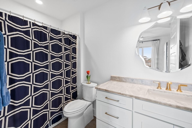 bathroom with vanity, toilet, and a shower with curtain