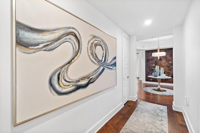 hallway with baseboards and dark wood finished floors