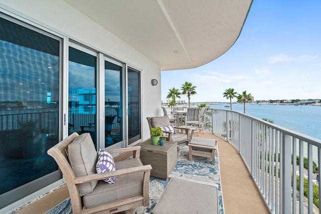 balcony featuring a water view