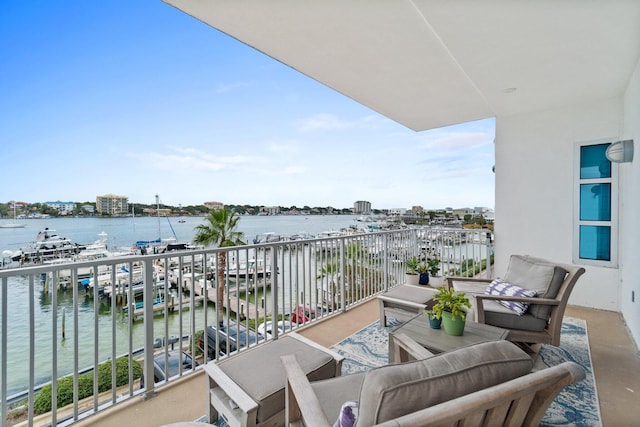balcony featuring a water view