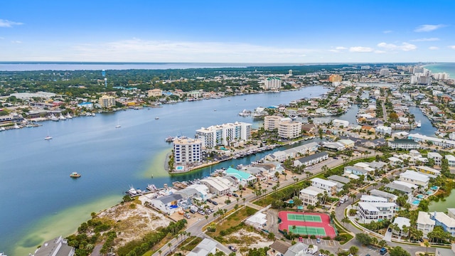 birds eye view of property with a city view and a water view