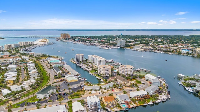 birds eye view of property featuring a water view and a city view