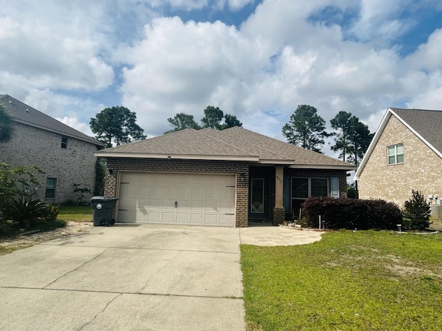 897 Cocobolo Dr, Santa Rosa Beach, FL 32459 - view of front of property with brick siding, an attached garage, driveway, a front lawn, and a shingled roof
