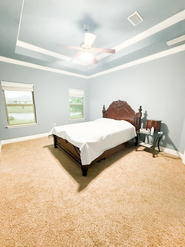 897 Cocobolo Dr, Santa Rosa Beach, FL 32459 - bedroom featuring a raised ceiling, carpet flooring, crown molding, baseboards, and ceiling fan