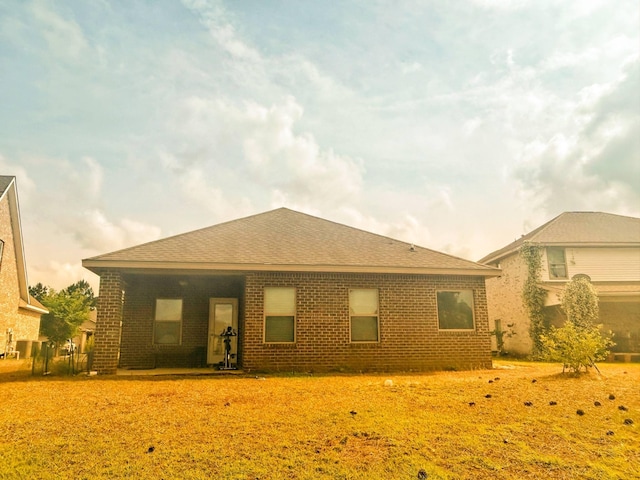 897 Cocobolo Dr, Santa Rosa Beach, FL 32459 - back of property featuring brick siding and roof with shingles