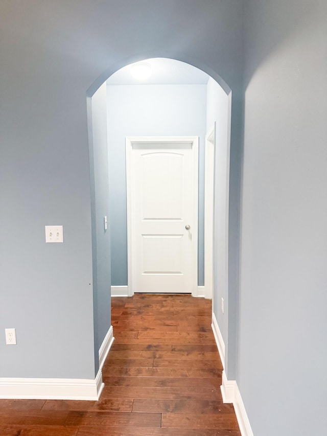 897 Cocobolo Dr, Santa Rosa Beach, FL 32459 - hall featuring hardwood / wood-style flooring, arched walkways, and baseboards