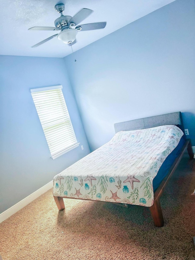 897 Cocobolo Dr, Santa Rosa Beach, FL 32459 - bedroom featuring carpet flooring, baseboards, and a ceiling fan