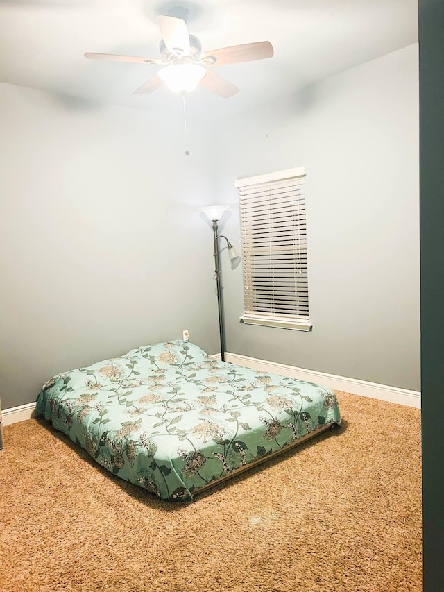 897 Cocobolo Dr, Santa Rosa Beach, FL 32459 - carpeted bedroom with baseboards and a ceiling fan