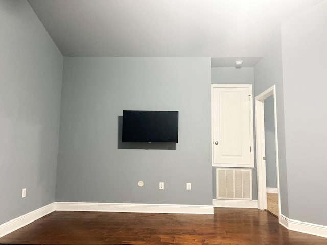 897 Cocobolo Dr, Santa Rosa Beach, FL 32459 - unfurnished living room with baseboards and wood finished floors