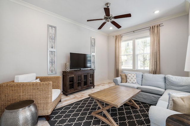 living room featuring a ceiling fan, ornamental molding, recessed lighting, and baseboards