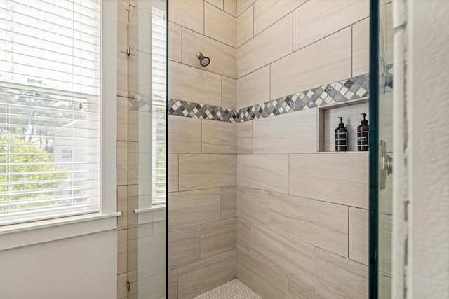 full bath featuring a shower stall