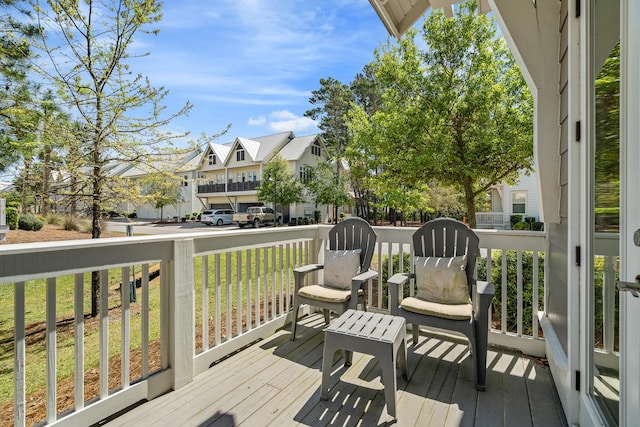 wooden deck with a residential view