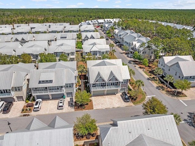 birds eye view of property with a wooded view and a residential view