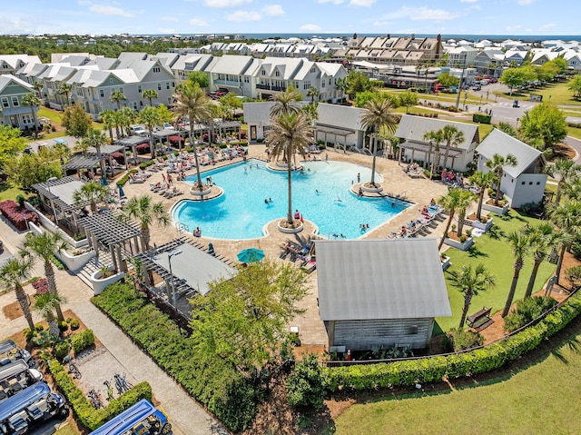 community pool with a residential view