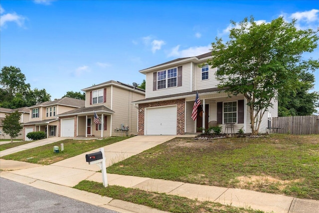 291 Dahlquist Dr, Crestview, FL 32539 - view of front of house with a porch, driveway, an attached garage, and brick siding