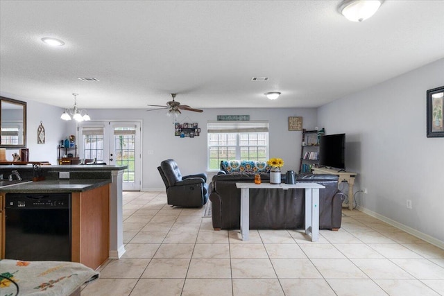 291 Dahlquist Dr, Crestview, FL 32539 - living area featuring plenty of natural light, light tile patterned floors, ceiling fan, and baseboards