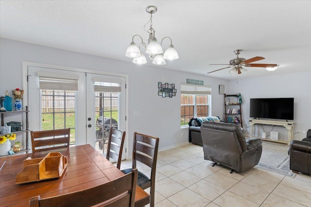 291 Dahlquist Dr, Crestview, FL 32539 - dining room with french doors, light tile patterned flooring, a chandelier, a ceiling fan, and baseboards