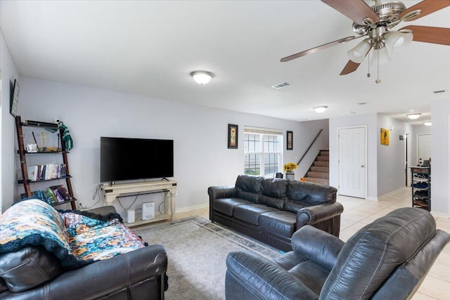 291 Dahlquist Dr, Crestview, FL 32539 - living room featuring stairs, light tile patterned flooring, ceiling fan, and baseboards