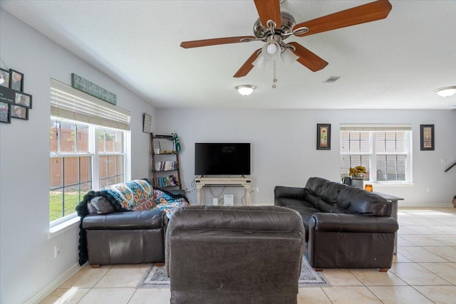 291 Dahlquist Dr, Crestview, FL 32539 - living area with light tile patterned flooring, ceiling fan, and baseboards
