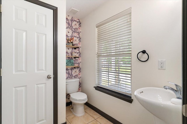291 Dahlquist Dr, Crestview, FL 32539 - bathroom with tile patterned floors, toilet, and a sink