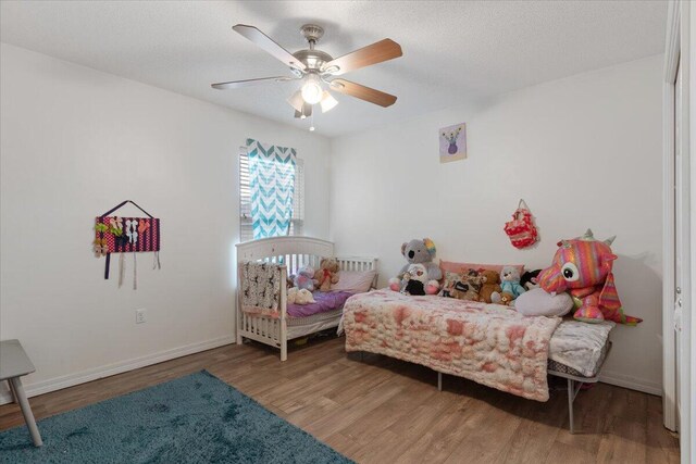 291 Dahlquist Dr, Crestview, FL 32539 - bedroom featuring wood finished floors, baseboards, and a ceiling fan