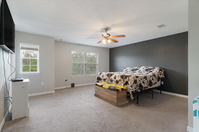 291 Dahlquist Dr, Crestview, FL 32539 - bedroom featuring light colored carpet, baseboards, a textured ceiling, and ceiling fan