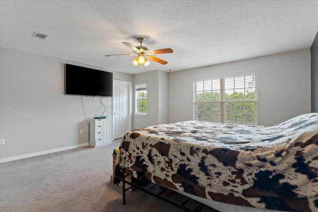 291 Dahlquist Dr, Crestview, FL 32539 - bedroom featuring carpet flooring, baseboards, a ceiling fan, and a textured ceiling
