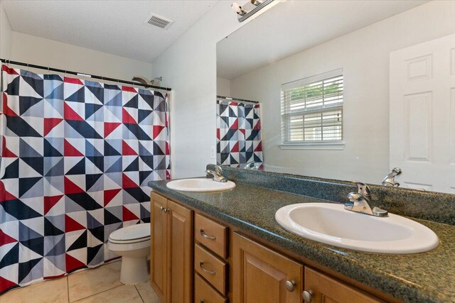 291 Dahlquist Dr, Crestview, FL 32539 - bathroom with toilet, tile patterned flooring, double vanity, and curtained shower