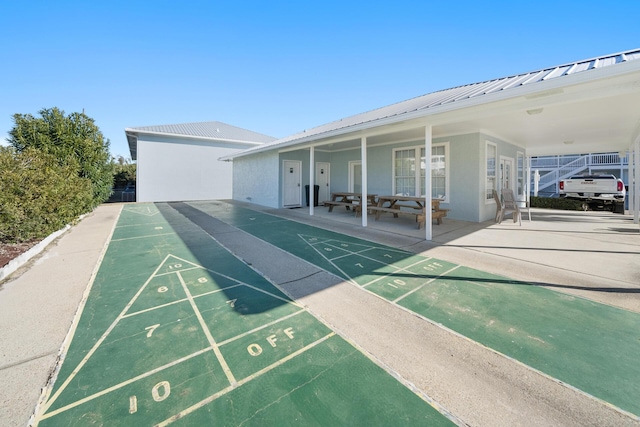 view of community featuring shuffleboard