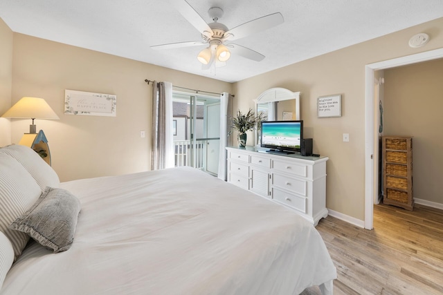 bedroom featuring baseboards, light wood finished floors, access to outside, and a ceiling fan