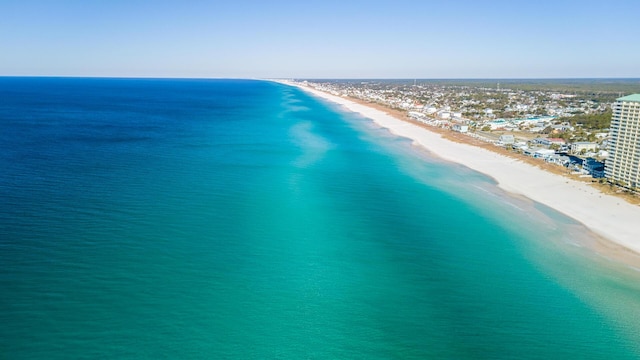 aerial view featuring a water view and a beach view