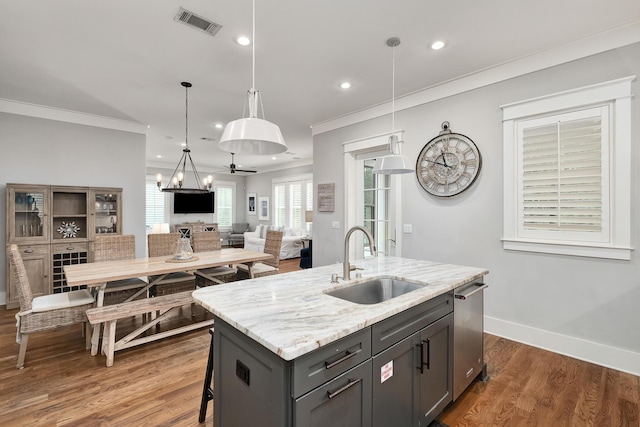257 Matts Way, Santa Rosa Beach, FL 32459 - kitchen with recessed lighting, crown molding, a center island with sink, and a sink