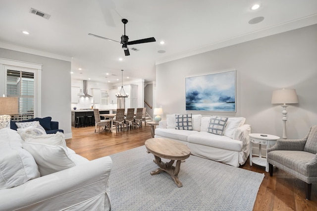 257 Matts Way, Santa Rosa Beach, FL 32459 - living room featuring crown molding, a ceiling fan, visible vents, and recessed lighting