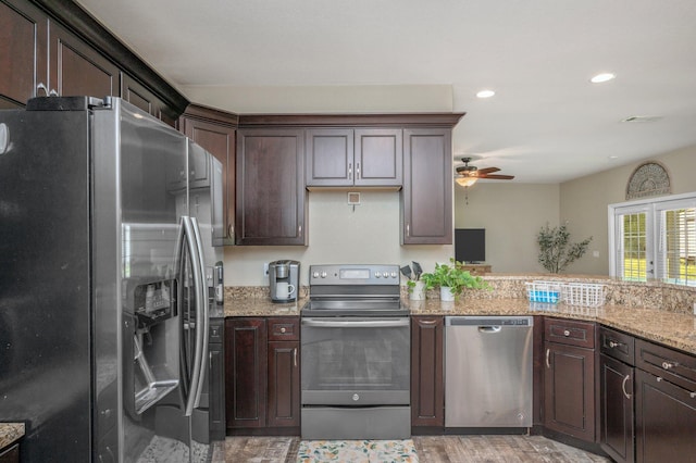 kitchen featuring dark brown cabinets, light stone counters, light wood finished floors, ceiling fan, and stainless steel appliances