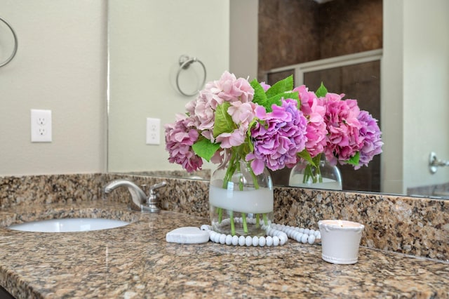interior details featuring backsplash and vanity